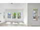 Bright living room featuring large windows offering views of the community at 9015 Rothman Ln, Lakewood Ranch, FL 34240