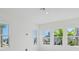 Bright living room featuring large windows offering views of the community at 9015 Rothman Ln, Lakewood Ranch, FL 34240