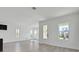 Bright living room featuring large windows offering views of the community at 9015 Rothman Ln, Lakewood Ranch, FL 34240