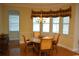 Dining area features a chandelier and large windows at 13550 Thoroughbred Dr, Dade City, FL 33525