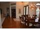 Dining room features hardwood floors and a chandelier at 13550 Thoroughbred Dr, Dade City, FL 33525