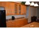 Lovely kitchen with wood cabinets, granite countertops, and stainless steel appliances at 13550 Thoroughbred Dr, Dade City, FL 33525