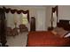 Bedroom with a large window, seating area, and a warm color scheme creating a cozy and inviting ambiance at 13550 Thoroughbred Dr, Dade City, FL 33525