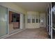 Covered patio features brick flooring, screened enclosure, golf course views, and seamless indoor-outdoor living at 13550 Thoroughbred Dr, Dade City, FL 33525