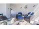 Relaxing screened-in porch with comfortable seating and colorful pillows and cushions at 8461 Buttonquail Dr, Englewood, FL 34224