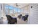 Bright sunroom with vaulted ceiling and ceiling fan provides additional living space at 8461 Buttonquail Dr, Englewood, FL 34224