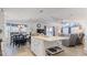 Open concept kitchen, living room, and dining area with lots of light and an open floorplan at 8461 Buttonquail Dr, Englewood, FL 34224