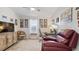 Comfortable office featuring a workspace, a cozy recliner, and lots of natural light at 8461 Buttonquail Dr, Englewood, FL 34224