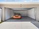 Garage with an orange car parked inside at 13003 Upward Pl, Riverview, FL 33579