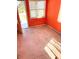 Vacant bedroom with orange walls, carpeting and ample sunlight at 4602 N 36Th St, Tampa, FL 33610