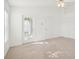 Bright, carpeted bedroom with a ceiling fan and a glass door at 7444 Tower Bridge Dr, Wesley Chapel, FL 33545