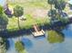 Bird's-eye view highlighting a canal-front property with a private deck and boat dock, perfect for waterfront living at 3427 Minnow Creek Dr, Hernando Beach, FL 34607