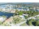 An aerial view of a waterfront community, highlighting its canal access and prime location at 3427 Minnow Creek Dr, Hernando Beach, FL 34607