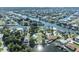 Aerial view of waterfront properties along winding canals, showcasing a serene coastal community at 3427 Minnow Creek Dr, Hernando Beach, FL 34607