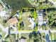 Aerial shot of waterfront property showing the property line, boat dock, and surrounding neighborhood at 3427 Minnow Creek Dr, Hernando Beach, FL 34607