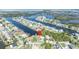 Aerial view of waterfront homes with canal access to the Gulf of Mexico, highlighting the community's coastal charm at 3427 Minnow Creek Dr, Hernando Beach, FL 34607