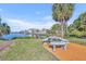 Scenic waterfront backyard with a cozy picnic area, perfect for enjoying outdoor meals and stunning water views at 3427 Minnow Creek Dr, Hernando Beach, FL 34607