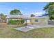 Inviting home with metal roof, well-maintained lawn, offering a blend of comfort and curb appeal at 3427 Minnow Creek Dr, Hernando Beach, FL 34607
