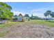 Charming, bright home with a spacious yard, mature trees, and an inviting front porch and outdoor seating at 3427 Minnow Creek Dr, Hernando Beach, FL 34607