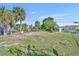 Expansive yard with palm trees, showcasing the property's potential for outdoor living and landscaping opportunities at 3427 Minnow Creek Dr, Hernando Beach, FL 34607