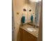 Bathroom vanity features granite countertop, undermount sink, and decorative fish accents at 5271 Visionary Ct, Sarasota, FL 34233
