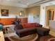 Upstairs bonus room features an exercise machine and a comfortable place to relax at 5271 Visionary Ct, Sarasota, FL 34233