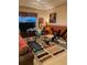 Bright home exercise room with modern equipment including a treadmill, elliptical, and weight bench at 5271 Visionary Ct, Sarasota, FL 34233
