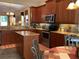 Well-equipped kitchen features granite countertops, stainless steel appliances, and ample cabinet space at 5271 Visionary Ct, Sarasota, FL 34233