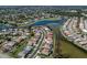 An aerial shot showcases the community's layout with residences, lake views, and well-planned streets at 519 Purslane Pt, Venice, FL 34293
