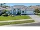 Charming home with well-manicured lawn, an arched entry, and a two car garage at 519 Purslane Pt, Venice, FL 34293