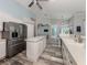 Bright kitchen featuring stainless steel appliances, white cabinetry, quartz countertops, and an open layout at 519 Purslane Pt, Venice, FL 34293