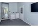 Light and bright laundry room featuring a washer and dryer, as well as access to another room at 519 Purslane Pt, Venice, FL 34293