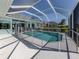 A stunning screened-in pool area with clear blue water and a -safe pool fence at 519 Purslane Pt, Venice, FL 34293