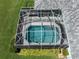 Aerial view highlighting the pool area with a screened-in enclosure and poolside space at 519 Purslane Pt, Venice, FL 34293