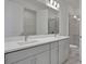 Modern bathroom with double sink vanity, white quartz countertops, and walk-in glass shower at 192 Eagleston Ln, Lakewood Ranch, FL 34240