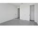 A bright bedroom featuring neutral walls, closet, and multiple doorways at 17350 Crisp Apple Ln, Land O Lakes, FL 34638