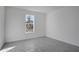 Bedroom featuring a large window and neutral walls at 17350 Crisp Apple Ln, Land O Lakes, FL 34638