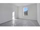 A bright bedroom featuring a large window and neutral walls at 17350 Crisp Apple Ln, Land O Lakes, FL 34638