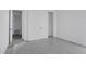 Spacious bedroom featuring neutral walls, closet, and multiple doorways at 17350 Crisp Apple Ln, Land O Lakes, FL 34638