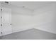 A bright bedroom features neutral paint, a door, and an access panel at 17350 Crisp Apple Ln, Land O Lakes, FL 34638