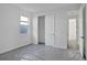 Bedroom featuring closet, window, and doorways at 17350 Crisp Apple Ln, Land O Lakes, FL 34638