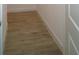 Hallway boasts neutral flooring, white baseboards and trim creating a seamless and modern aesthetic at 9572 Brave Buck Ave, Land O Lakes, FL 34638
