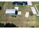 Aerial view of house and shed featuring a wide backyard with grass at 3708 Alafia Creek St, Plant City, FL 33567