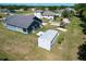 Aerial view of home and shed in a spacious, grassy backyard at 3708 Alafia Creek St, Plant City, FL 33567