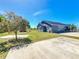 Backyard featuring a well-manicured lawn and a metal shed at 3708 Alafia Creek St, Plant City, FL 33567