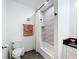 Bright bathroom featuring textured shower tile and modern finishes, and a combination shower-tub at 3708 Alafia Creek St, Plant City, FL 33567