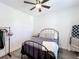 Inviting bedroom with warm accents, featuring a comfortable bed, blanket ladder, and stylish flooring at 3708 Alafia Creek St, Plant City, FL 33567