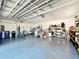 Spacious garage for storage and parking, features an automatic garage door and epoxy flooring at 3708 Alafia Creek St, Plant City, FL 33567