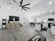 Open-concept area showing kitchen, dining, and living area with luxury vinyl plank flooring at 3708 Alafia Creek St, Plant City, FL 33567