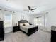 Main bedroom with neutral tones, comfortable furnishings, and ample natural light at 3708 Alafia Creek St, Plant City, FL 33567